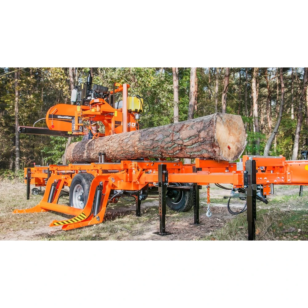 Wood-Mizer LT40 mobile sawmill with a log on the bed in the forest
