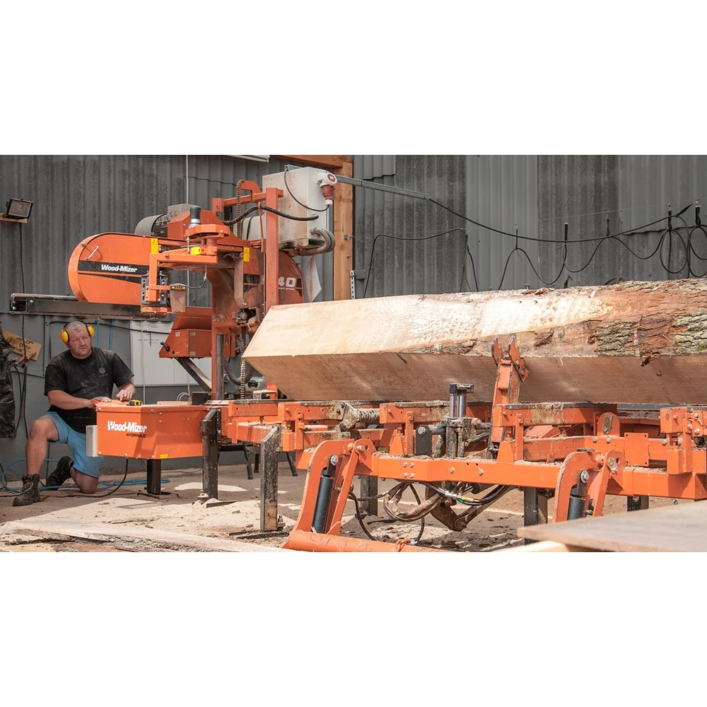 Wood-Mizer LT40 hydraulic sawmill cutting a log in a workshop