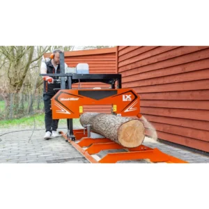 Operator cutting a log on the Wood-Mizer LX30 sawmill